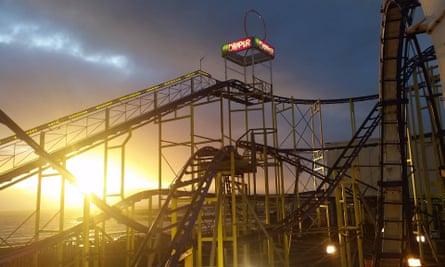 Rollercoaster ride, at sunset, at Barry’s Amusements, Portrush, Northern Ireland.
